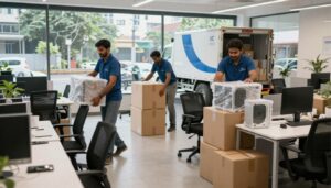 Office shifting process in Kolkata with professional packers and movers packing computers and office furniture safely
