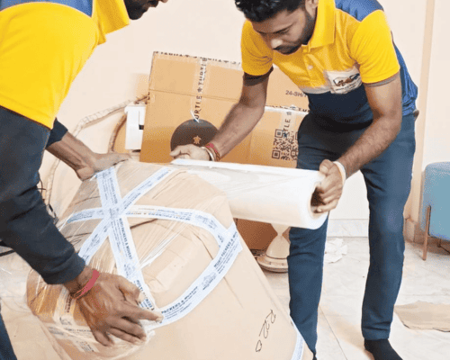 Professional packers and movers in Sector 37 Noida wrapping and packing household items safely for relocation